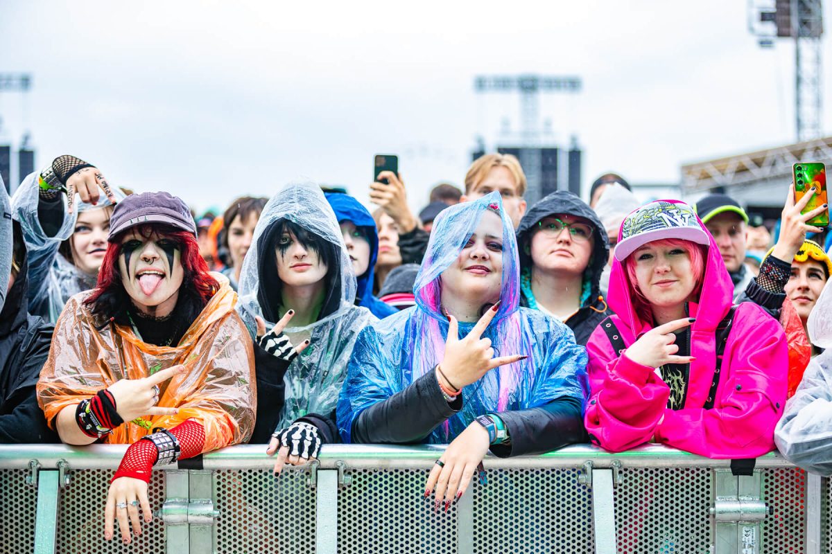 Festival people in raincoats at Rock for People