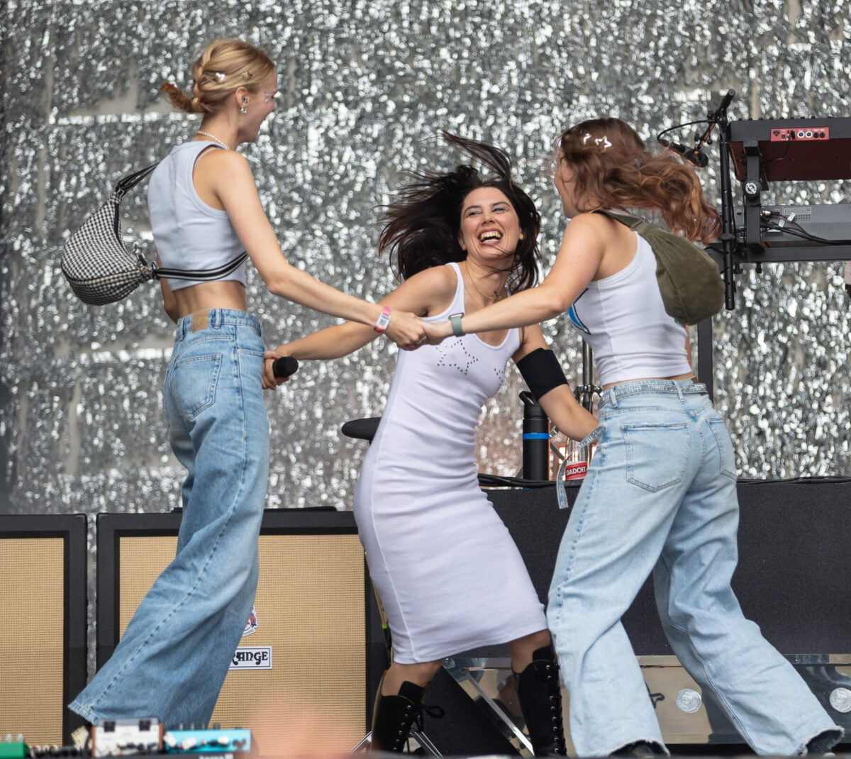 Wolf Alice dancing with two girls